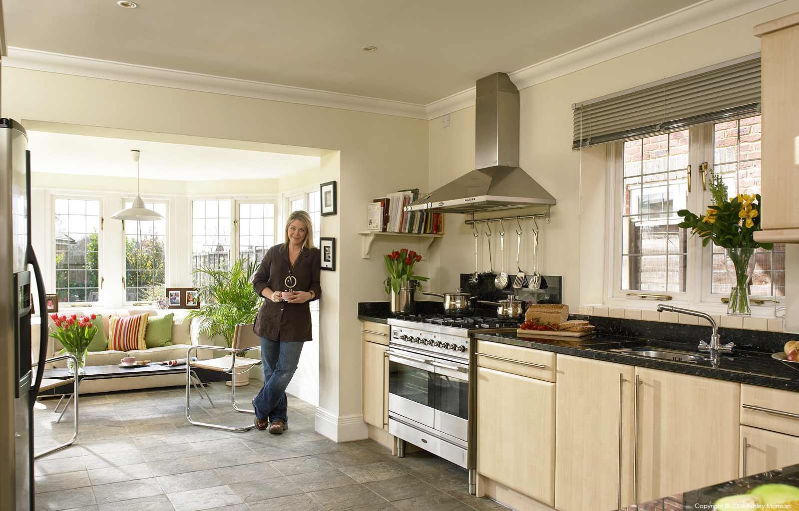 Lucy Alexander in the kitchen of her & Stewart Castledine's home near Thames Ditton in South West London by Ashley Morrison.