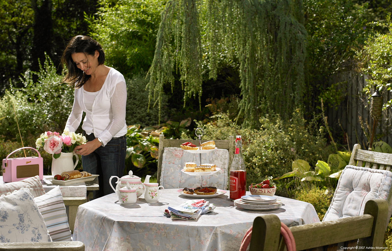 Debbie Cooper in the garden of her semi detached townhouse in the Malone area of Belfast.