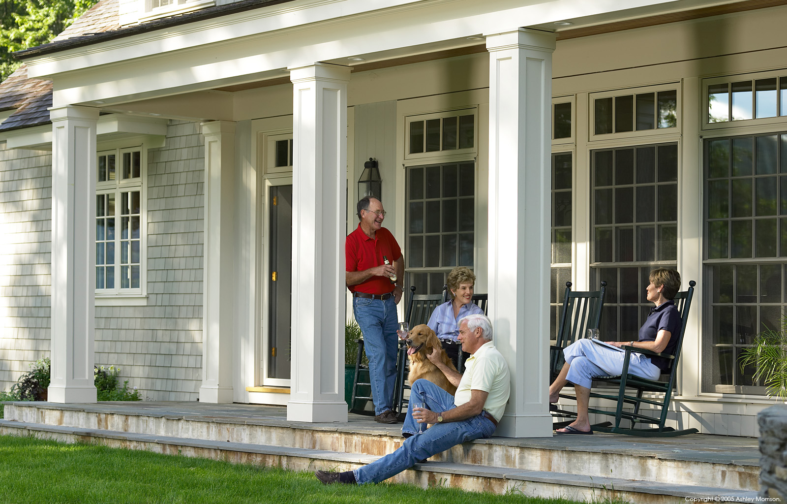 Mary Ann and William Lewis enjoying a cold beer with good friends on the porch outside their home near Hanover in New Hampshire by Ashley Morrison.