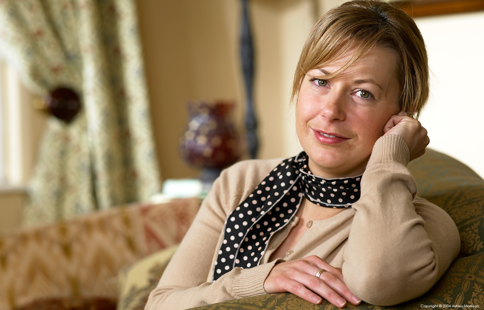 Marie McMillen sitting on the harbour pier overlooking Makrigialos Bay on the beautiful island of Crete in Greece by Ashley Morrison.
