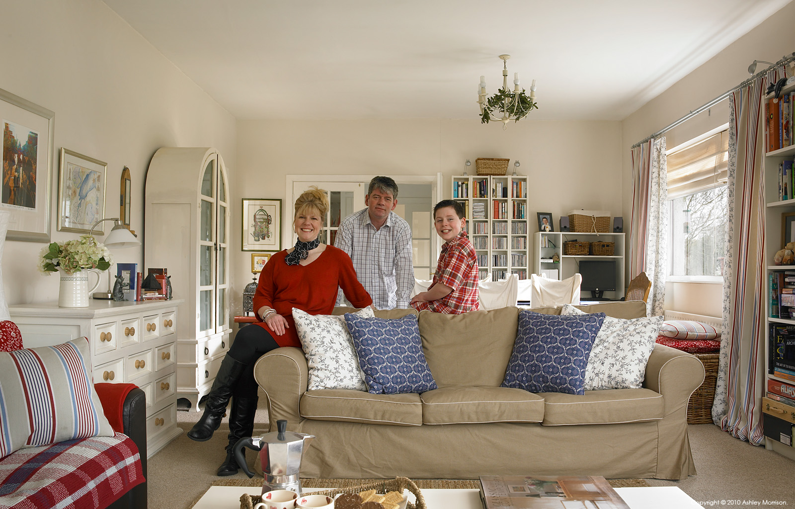 Mandi Millar with her family in the sitting room of their 1980s bungalow near the market town of Ballyclare in County Antrim.
