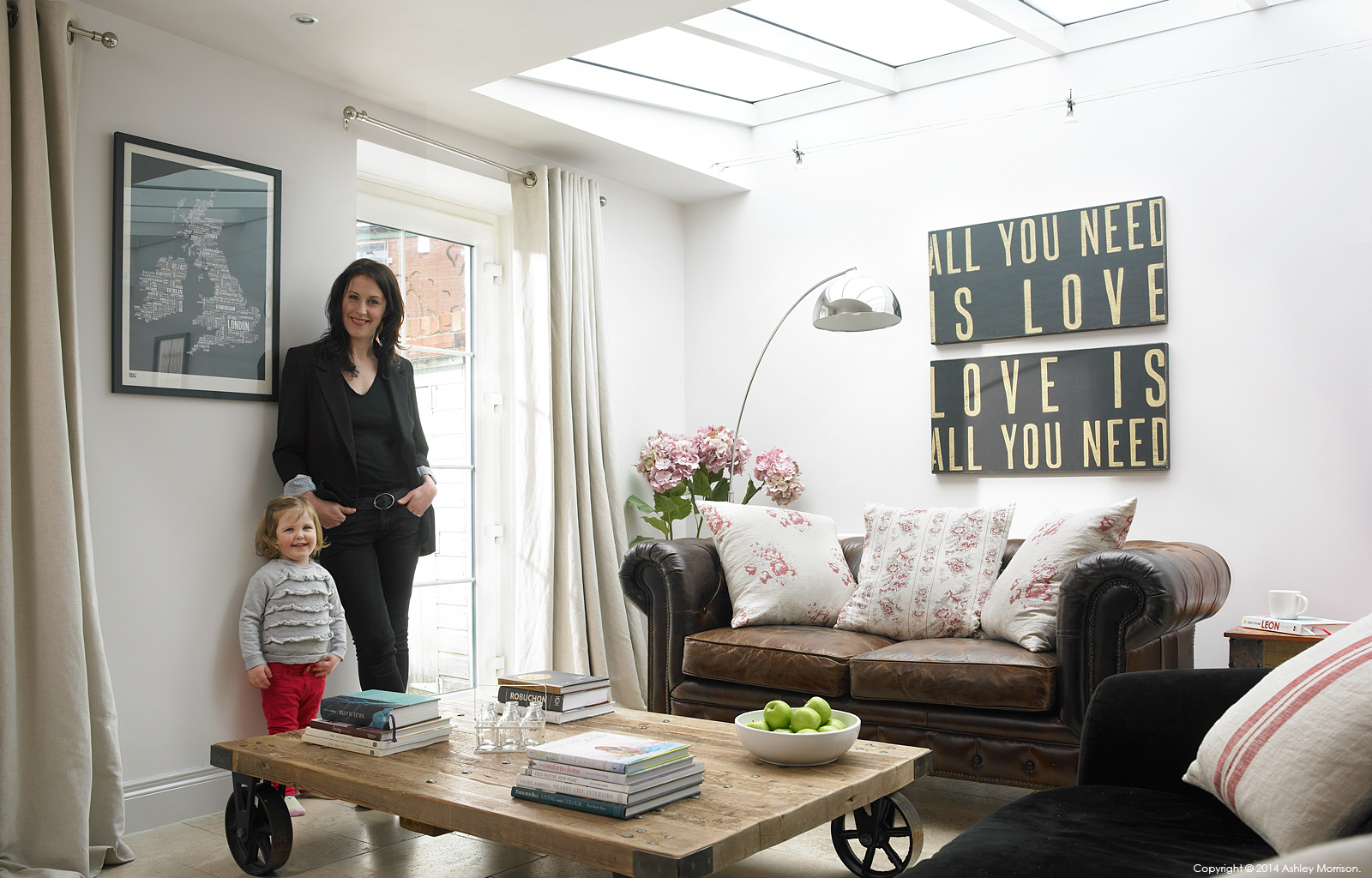 Kelly Ann Preston and her daughter Evie in the living room of their Victorian mid terrace townhouse in Belfast.