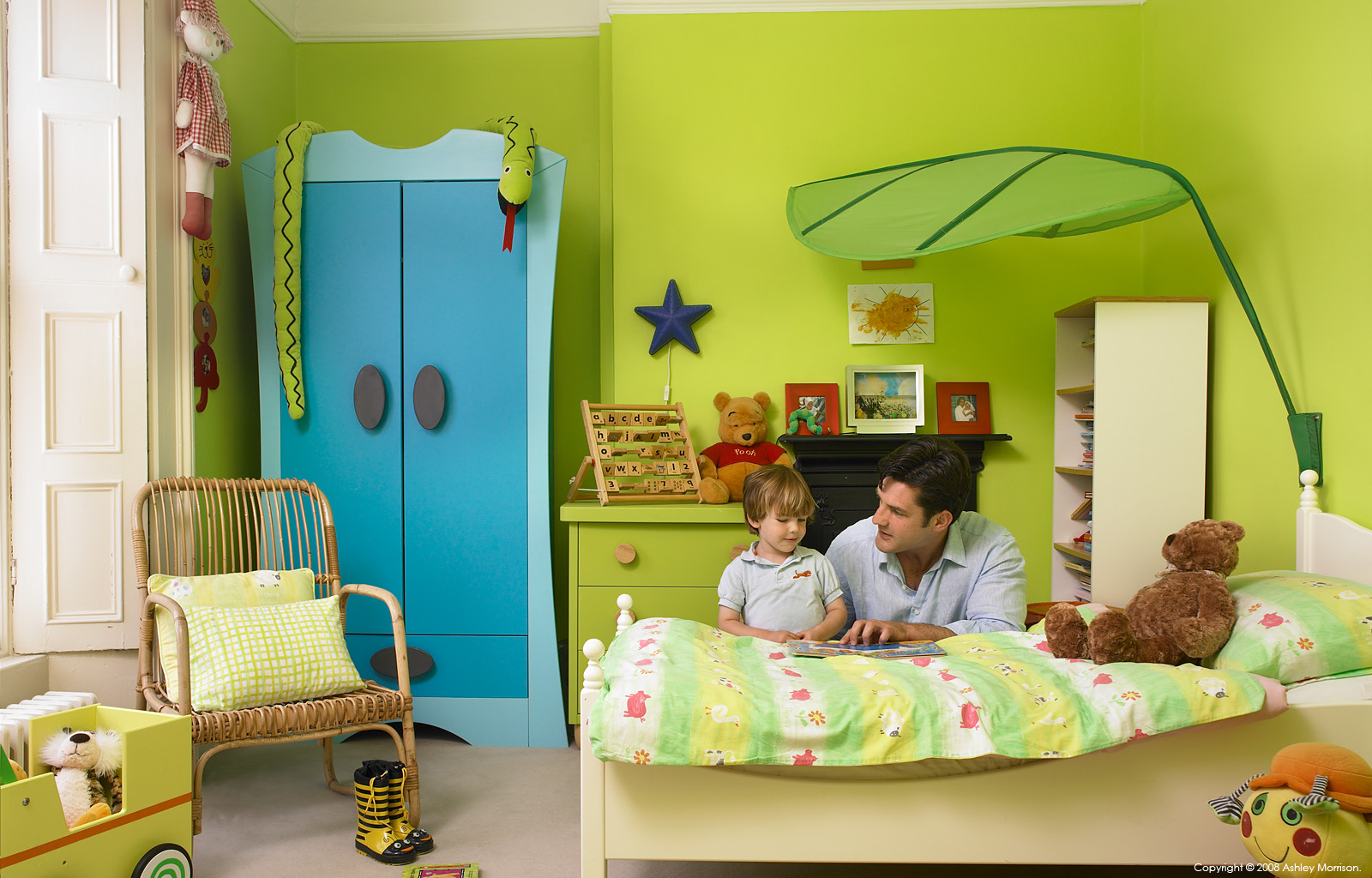 Maoilíosa Reynolds and his son in the bedroom of their early-Victorian terrace house in the Sandycove area of Dublin.