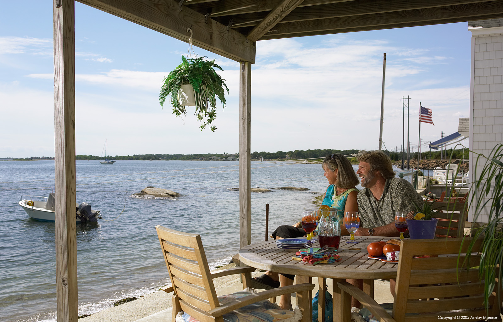 Maria Sylvia and Rick Dean outside their beach house called the 'Sea Shells' in Mystic.