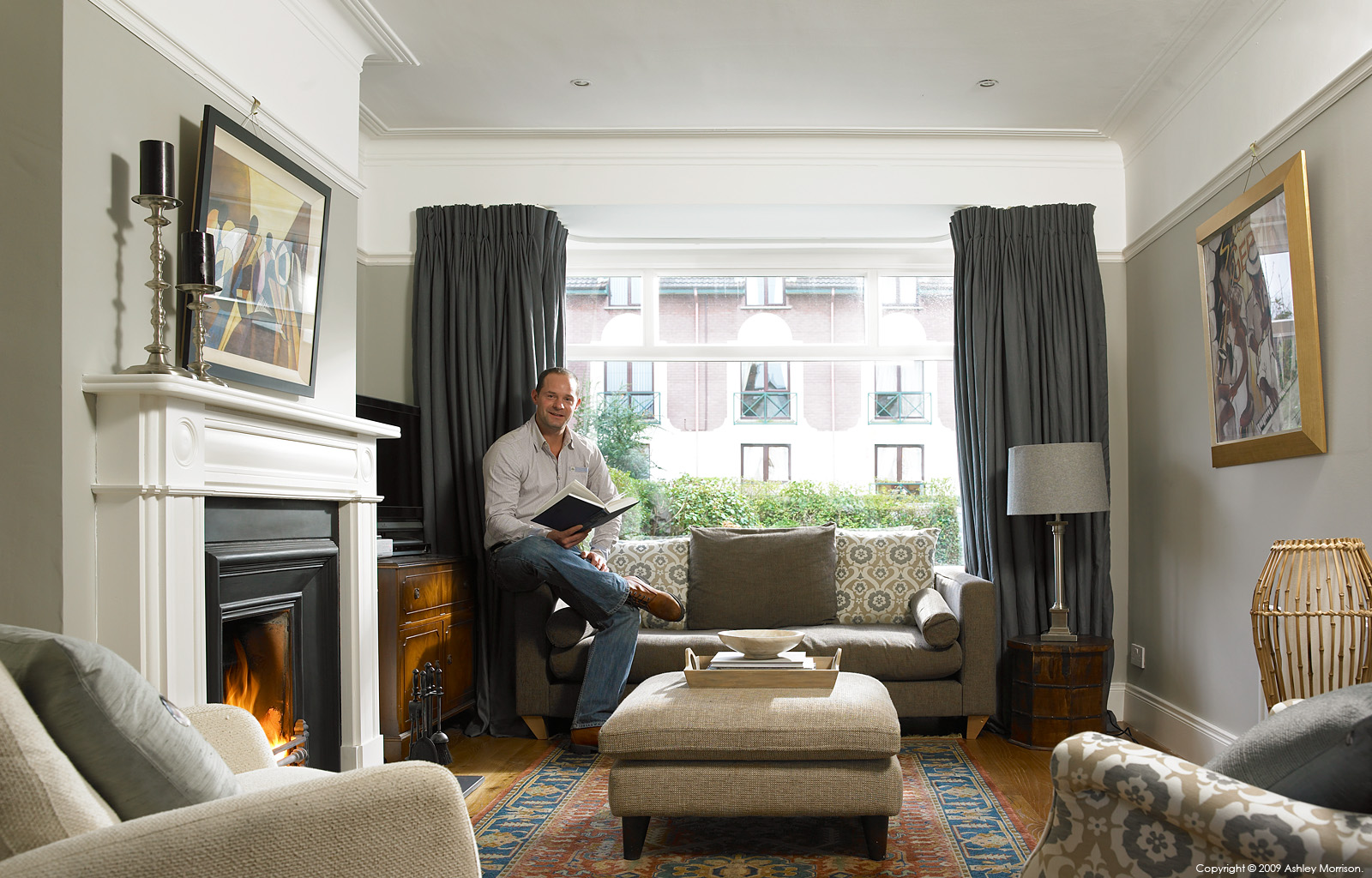 Andrew Webb in the sitting room of his semi detached house in the Belmont area of Belfast.