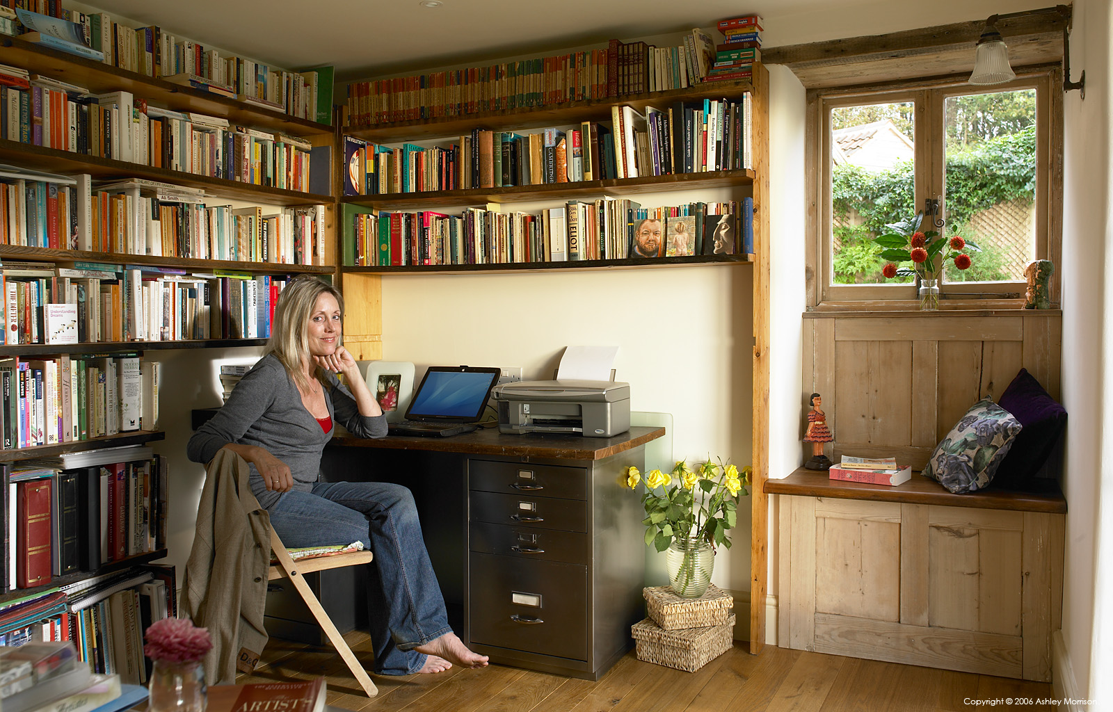 Julie-Christian Young in the library of her stone farmhouse near Bath by Ashley Morrison.