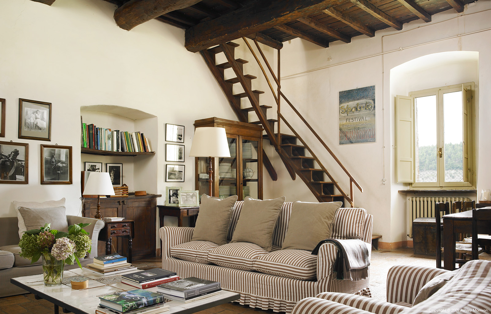 The living room in Claudia and Francesco Bachetoni's farmhouse called Casa del Melo da Fiore near Spoleto in the Umbria region of Italy.