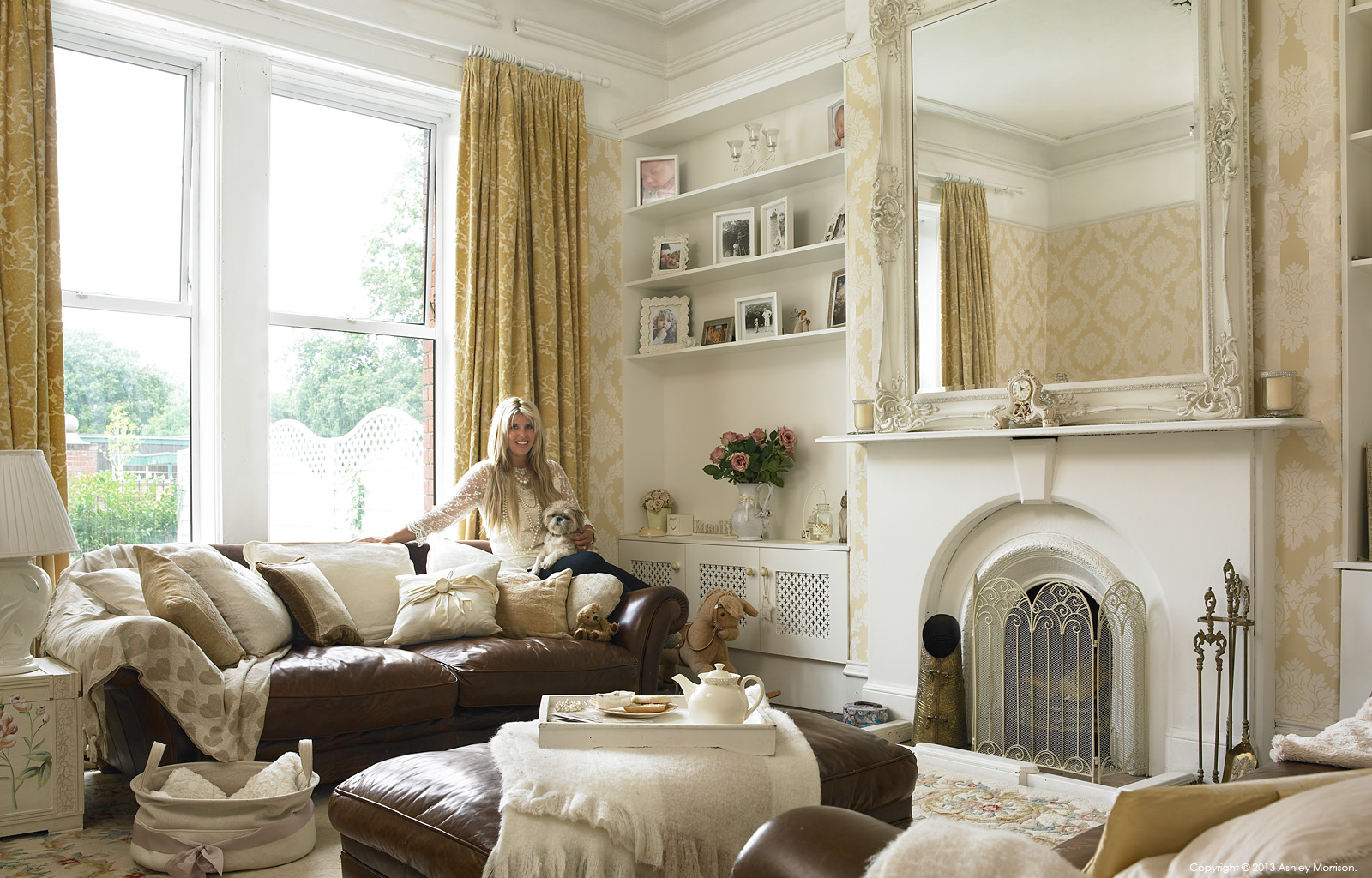 Amanda McGuile in the living room of her renovated double fronted mid terrace house in Belfast by Ashley Morrison.