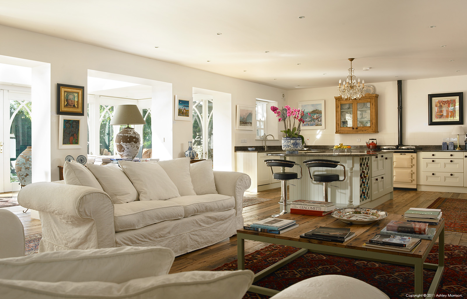 The living room and kitchen in Carolyn & Stewart Moore's Georgian house near Portstewart in Country Antrim by Ashley Morrison.