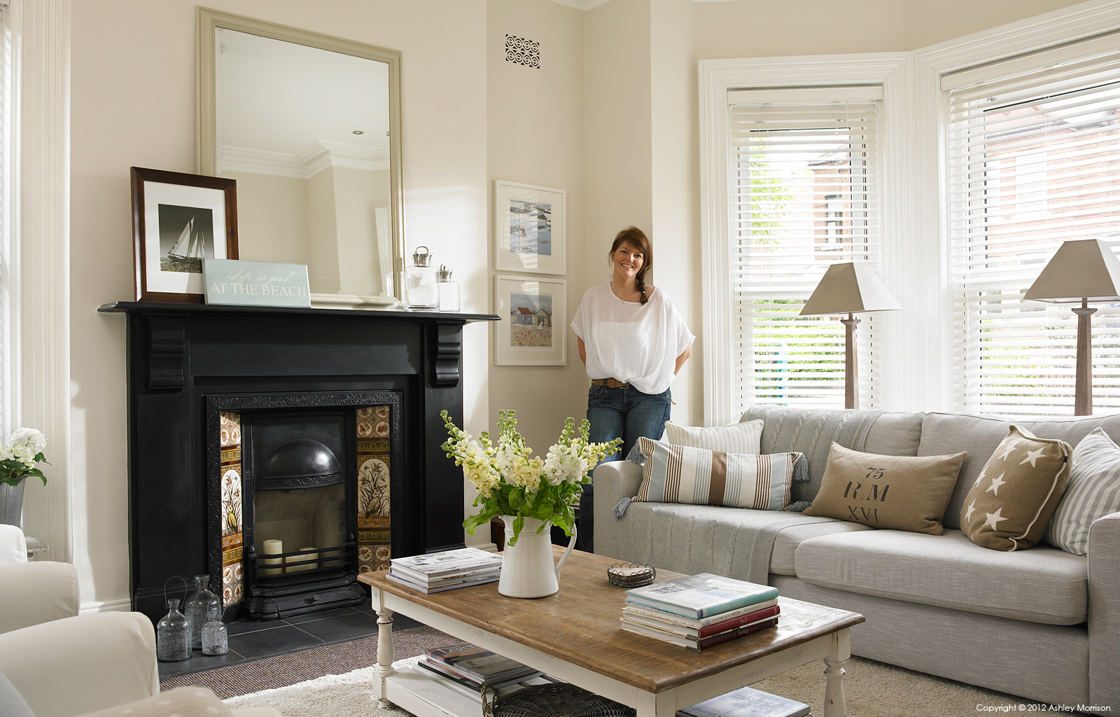 Ciara Newell in the sitting room of her three storey semi-detached villa in Belfast.