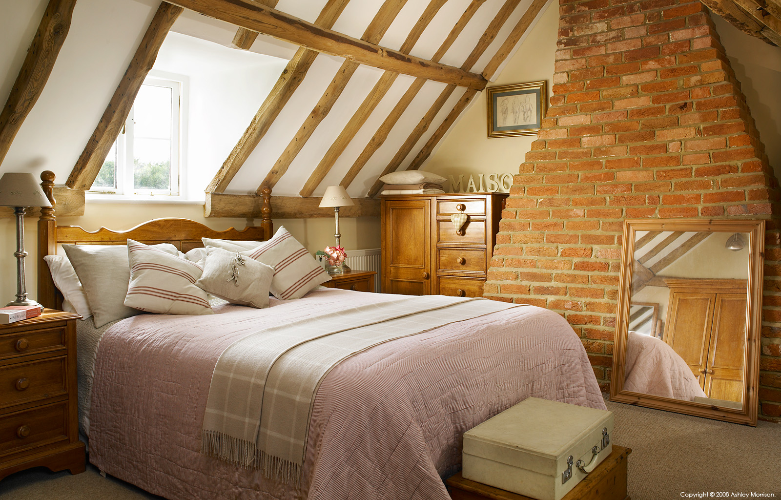 Bedroom in the attic of Tracey & Andy Rosser's cottage near Checkendon in Oxfordshire by Ashley Morrison.