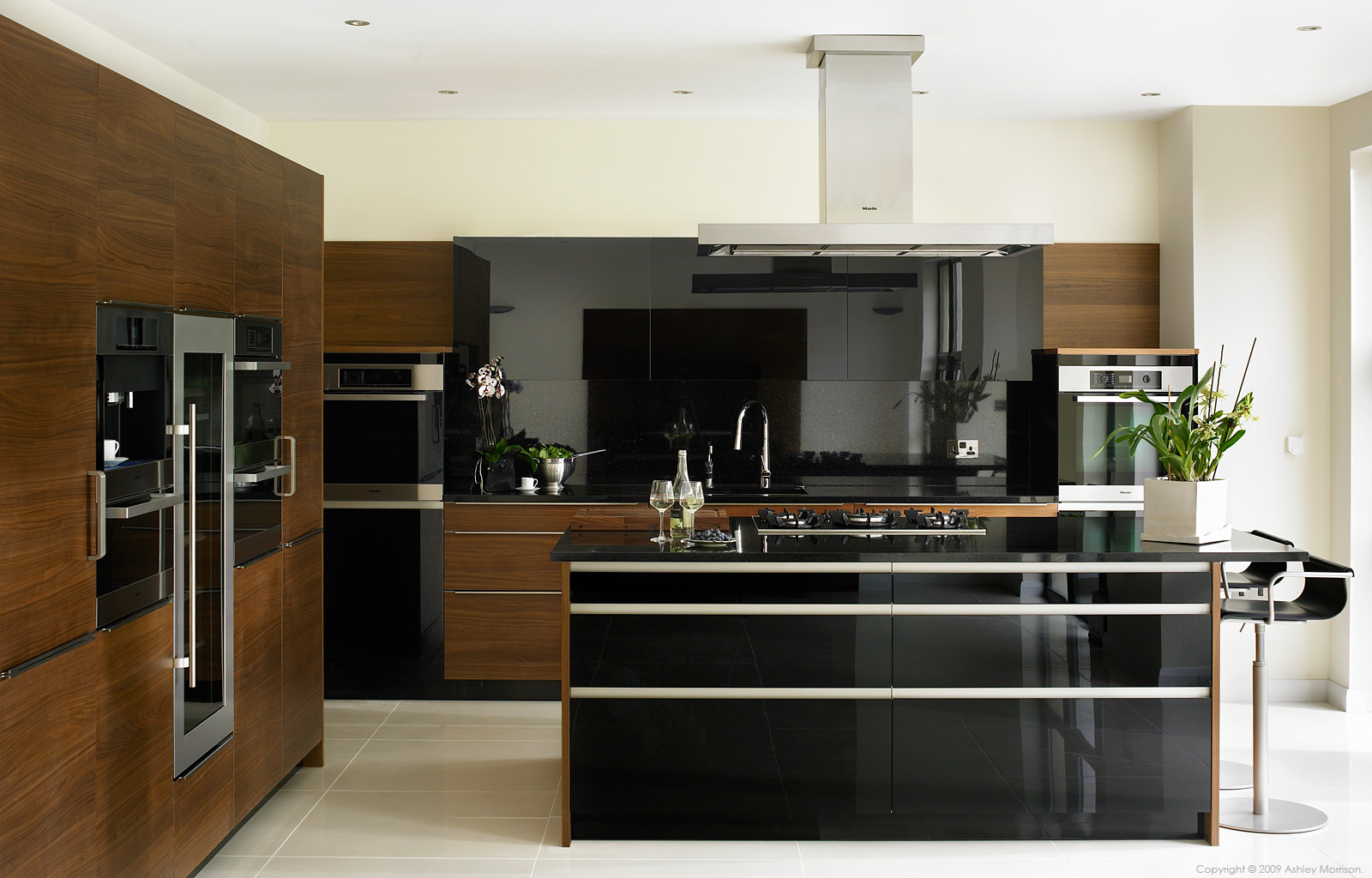 Black gloss and walnut kitchen by Robinson Interiors in a house near the County Down town of Comber.