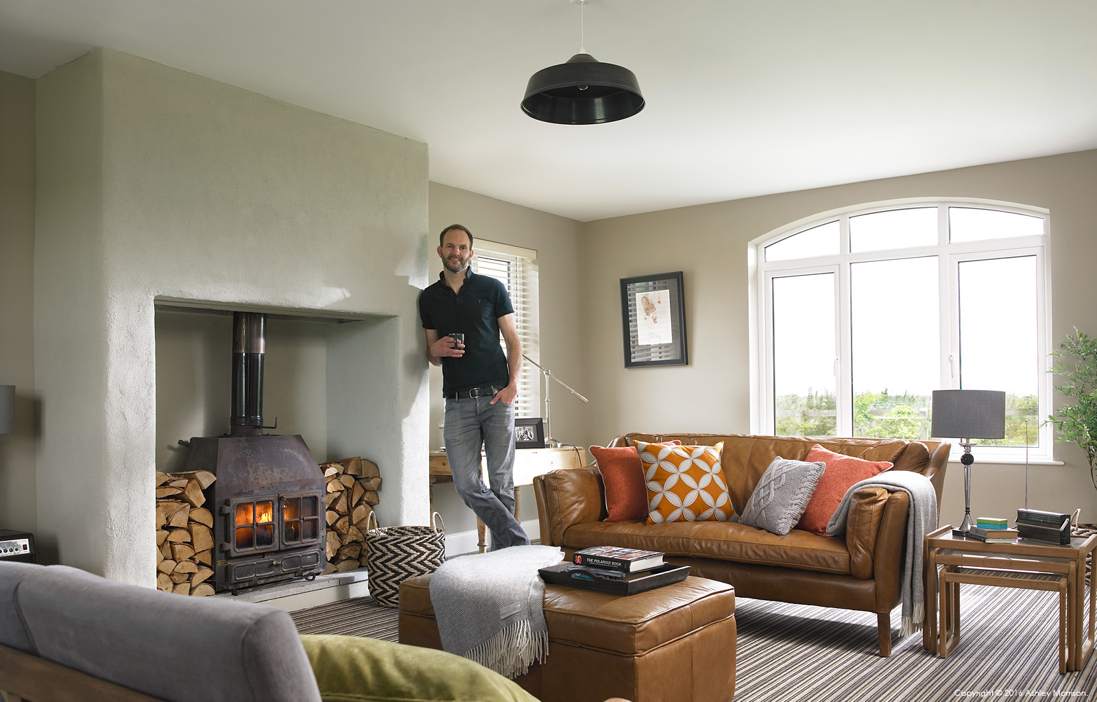 John Wilson in the sitting room of his house on the outskirts of the County Down seaside village of Ballyhalbert.
